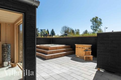 Njut av spabadets värme i lyxstuga nr 582 i Nordsjälland