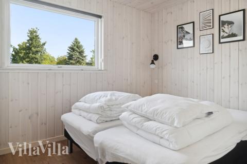 Ett av de 5 utmärkta sovrummen i lyxstuga nr 588 i Lolland/Falster/Møn.