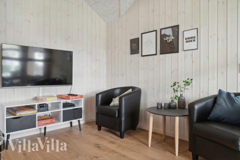 Tävla i sommarhusets aktivitetsrum när ni besöker lyxhus nr 588 i Lolland/Falster/Møn.