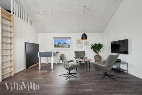 Tävla i sommarhusets aktivitetsrum när ni besöker lyxhus nr 610 i Vestjylland.