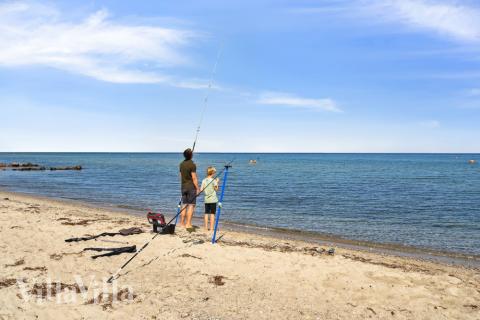 Stranden i närheten av lyxhus 617.