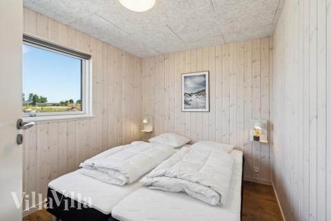 Ett av de 6 utmärkta sovrummen i lyxstuga nr 618 i Fyn och öar.
