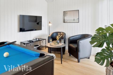 Tävla i sommarhusets aktivitetsrum när ni besöker lyxhus nr 644 i Lolland/Falster/Møn.