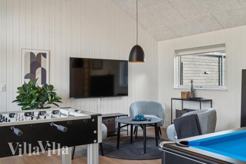 Tävla i sommarhusets aktivitetsrum när ni besöker lyxhus nr 646 i Nordsjälland.