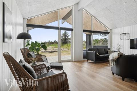 Tävla i sommarhusets aktivitetsrum när ni besöker lyxhus nr 822 i Østjylland.