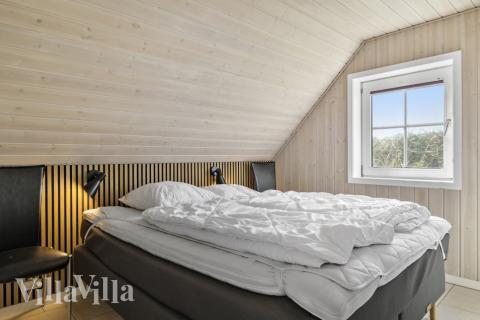 Ett av de 5 utmärkta sovrummen i lyxstuga nr 675 i Vestjylland.
