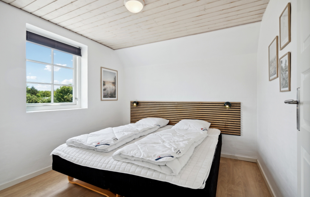 Ett av de 7 utmärkta sovrummen i lyxstuga nr 678 i Vestjylland.