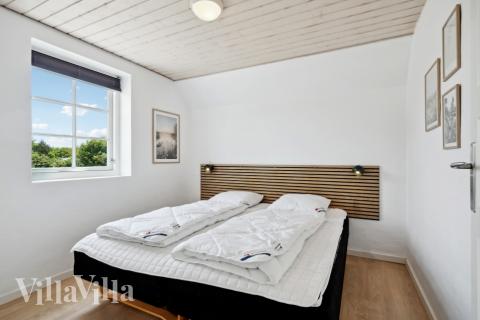 Ett av de 7 utmärkta sovrummen i lyxstuga nr 678 i Vestjylland.