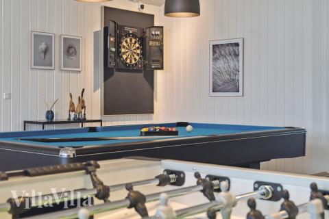 Tävla i sommarhusets aktivitetsrum när ni besöker lyxhus nr 652 i Nordjylland.