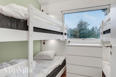 Ett av de 4 utmärkta sovrummen i lyxstuga nr 692 i Nordjylland.