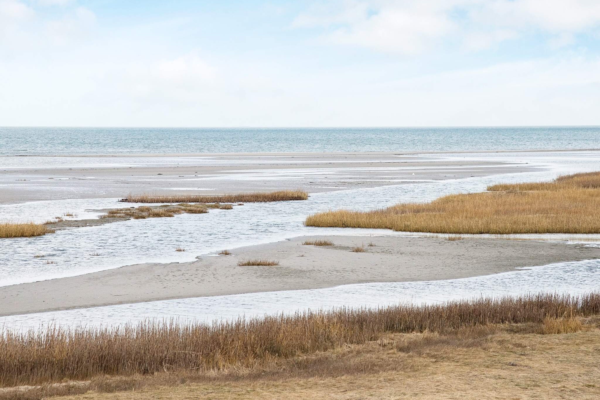 Stranden i närheten av lyxhus 690.