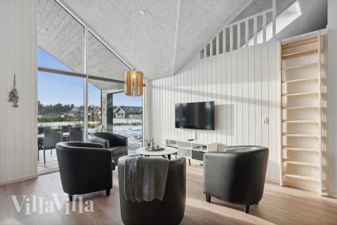 Tävla i sommarhusets aktivitetsrum när ni besöker lyxhus nr 605 i Vestjylland.