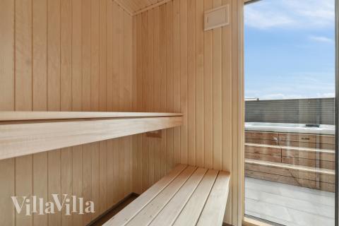 Njut av bastuvärmen i lyxstuga nr 665 för 14 personer