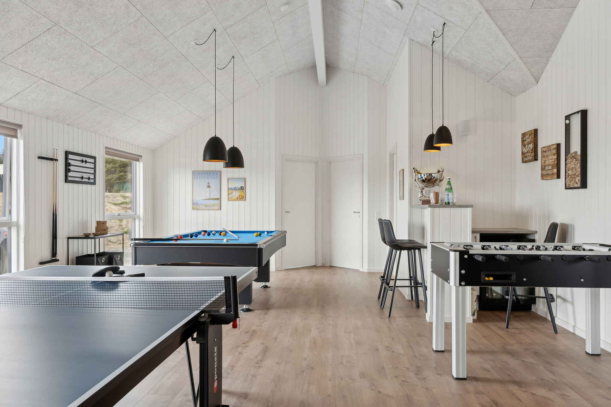 Tävla i sommarhusets aktivitetsrum när ni besöker lyxhus nr 658 i Nordjylland.