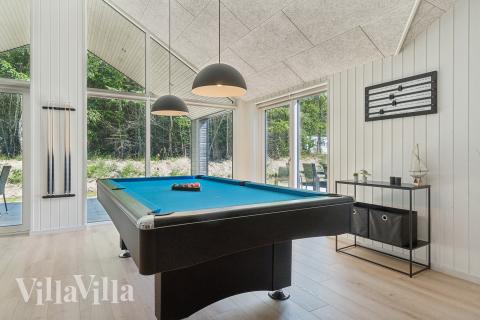 Tävla i sommarhusets aktivitetsrum när ni besöker lyxhus nr 817 i Østjylland.