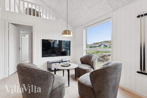 Tävla i sommarhusets aktivitetsrum när ni besöker lyxhus nr 672 i Vestjylland.