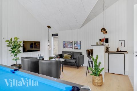 Tävla i sommarhusets aktivitetsrum när ni besöker lyxhus nr 900 i Vestjylland.