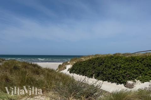 Stranden i närheten av lyxhus 911.