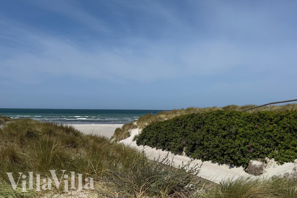 Stranden i närheten av lyxhus 911.