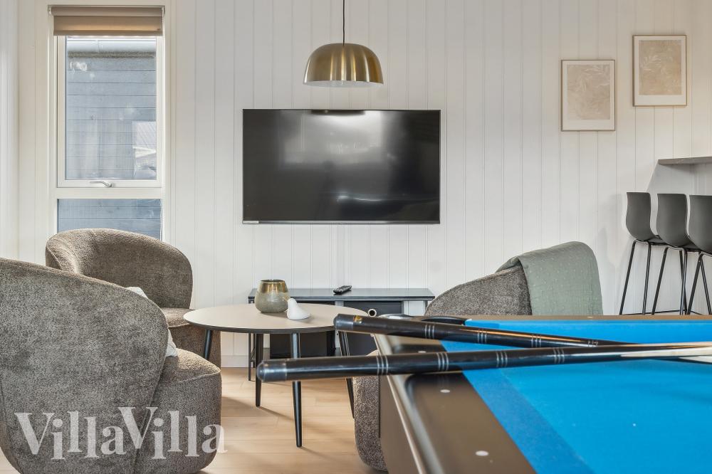 Tävla i sommarhusets aktivitetsrum när ni besöker lyxhus nr 912 i Lolland/Falster/Møn.