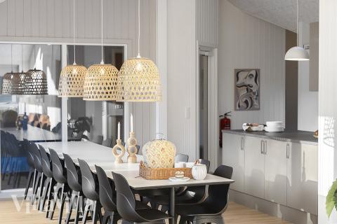 Det stora ljusa vardagsrummet i lyxstuga nr 802 för 16.