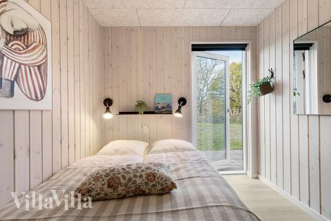Ett av de 6 utmärkta sovrummen i lyxstuga nr 802 i Østjylland.
