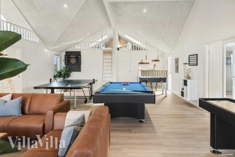 Tävla i sommarhusets aktivitetsrum när ni besöker lyxhus nr 910 i Lolland/Falster/Møn.