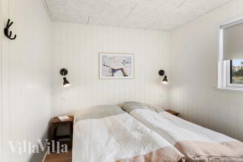 Ett av de 12 utmärkta sovrummen i lyxstuga nr 910 i Lolland/Falster/Møn.