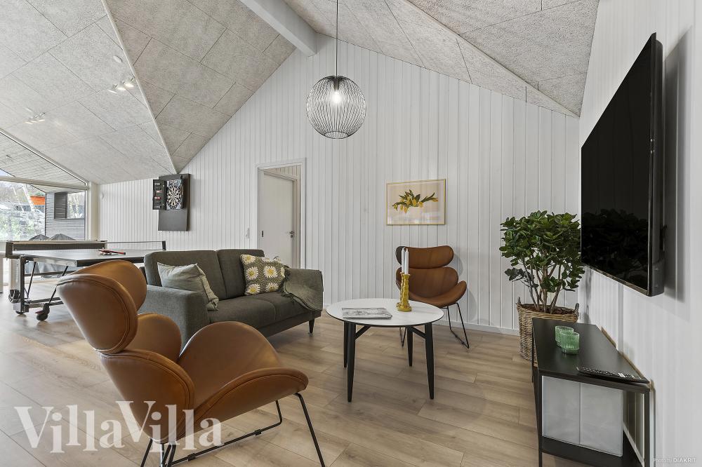 Tävla i sommarhusets aktivitetsrum när ni besöker lyxhus nr 814 i Østjylland.