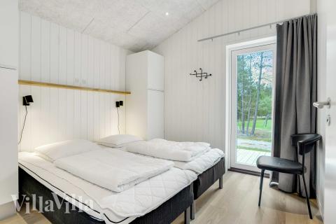 Ett av de 5 utmärkta sovrummen i lyxstuga nr 944 i Nordjylland.