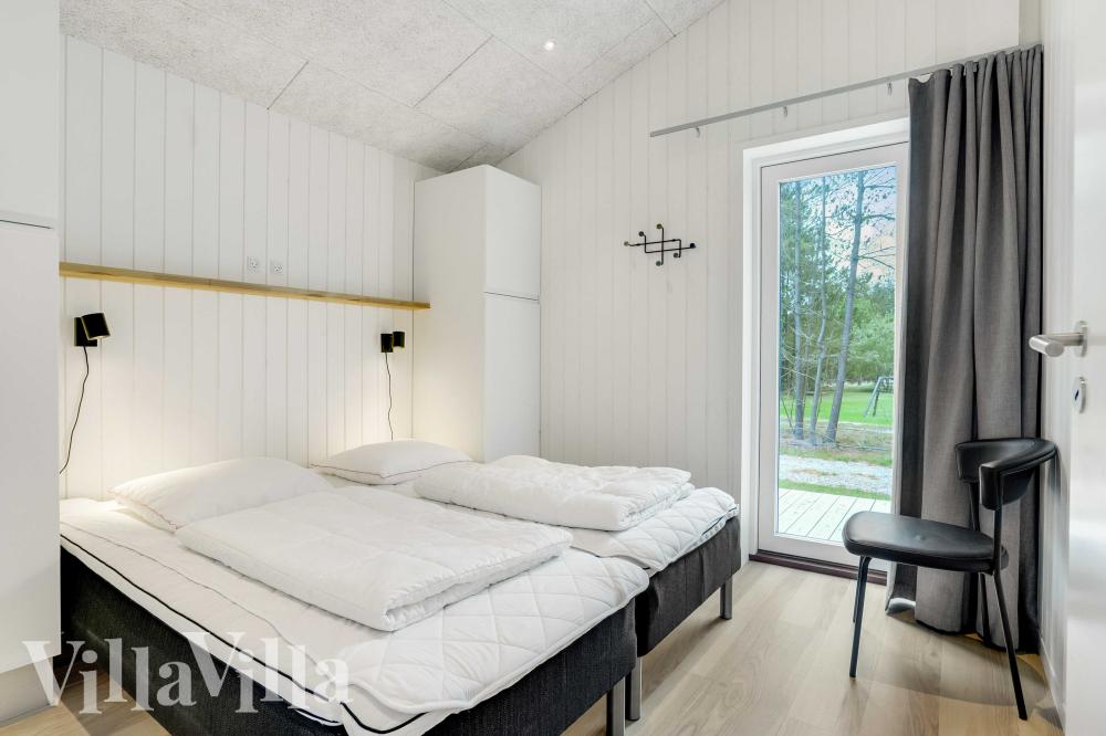 Ett av de 5 utmärkta sovrummen i lyxstuga nr 944 i Nordjylland.