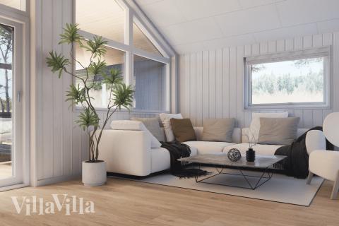 I soffhörnan i lyxstuga 947 i Vestjylland kan ni spela brädspel eller titta på film tillsammans.