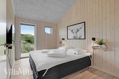 Ett av de 6 utmärkta sovrummen i lyxstuga nr 945 i Nordjylland.