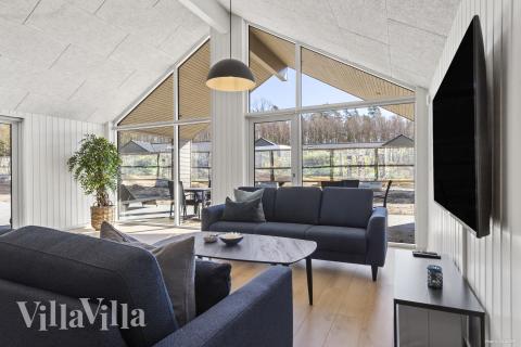 Tävla i sommarhusets aktivitetsrum när ni besöker lyxhus nr 822 i Østjylland.