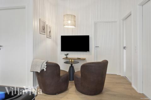 Aktivitetsrum i lyxstuga nr 919 med 6 sovrum och plats för 12 personer.