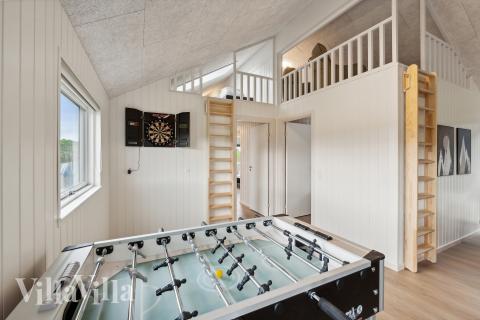 Tävla i sommarhusets aktivitetsrum när ni besöker lyxhus nr 960 i Lolland/Falster/Møn.