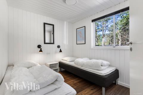 Ett av de 8 utmärkta sovrummen i lyxstuga nr 351 i Nordsjälland.