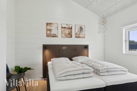 Ett av de 7 utmärkta sovrummen i lyxstuga nr 967 i Østjylland.