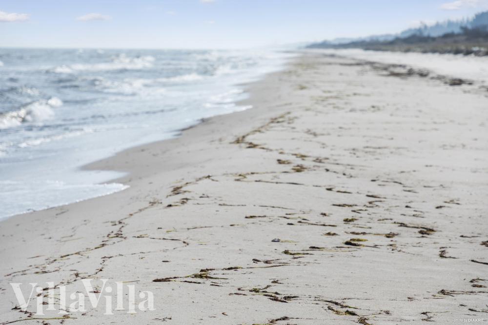 Stranden i närheten av lyxhus 314.