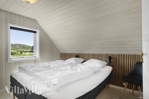 Ett av de 5 utmärkta sovrummen i lyxstuga nr 675 i Vestjylland.