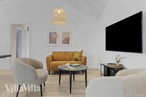 Aktivitetsrum i lyxstuga nr 828 med 10 sovrum och plats för 26 personer.
