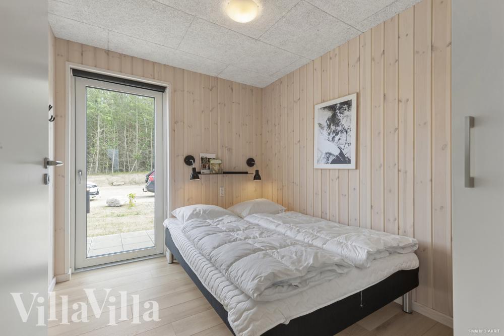 Ett av de 7 utmärkta sovrummen i lyxstuga nr 832 i Østjylland.