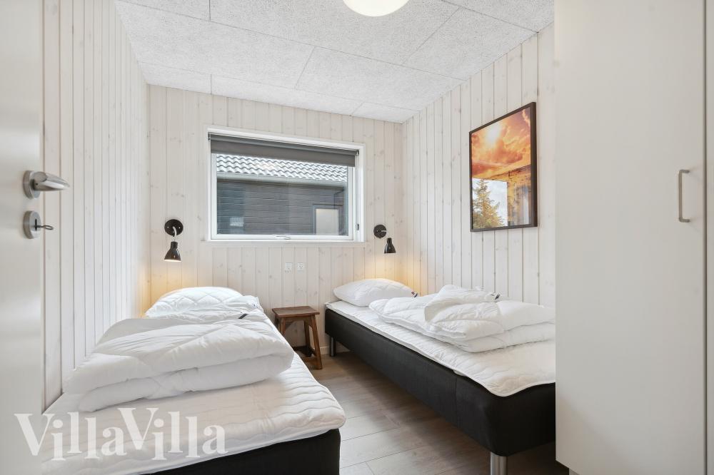 Ett av de 7 utmärkta sovrummen i lyxstuga nr 1006 i Vestjylland.