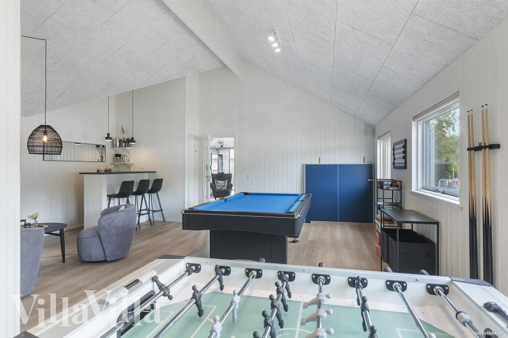Tävla i sommarhusets aktivitetsrum när ni besöker lyxhus nr 960 i Lolland/Falster/Møn.
