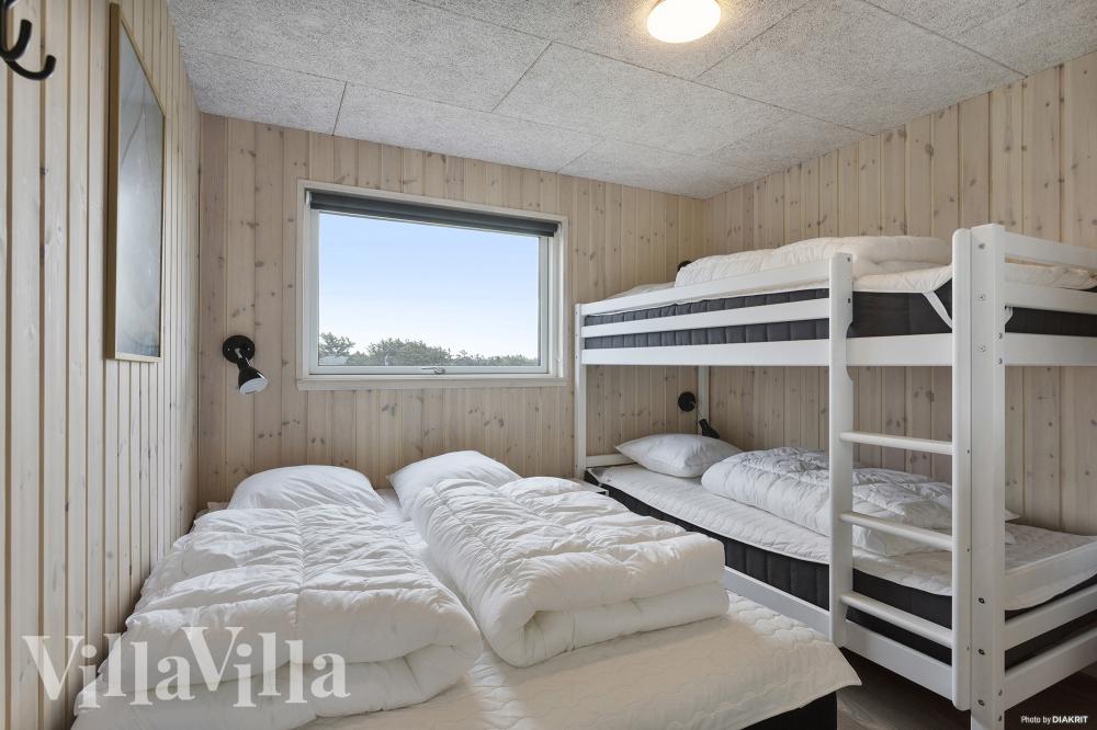 Ett av de 8 utmärkta sovrummen i lyxstuga nr 959 i Nordjylland.