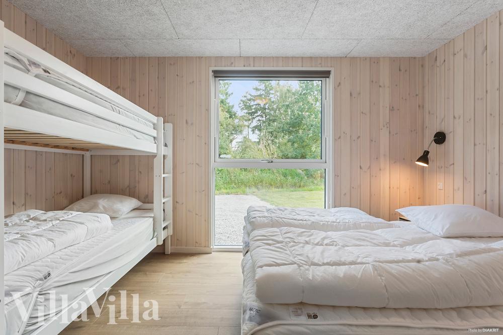 Ett av de 9 utmärkta sovrummen i lyxstuga nr 962 i Lolland/Falster/Møn.